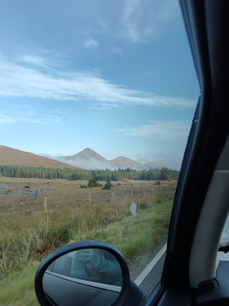 Mountains in the distance from the car window