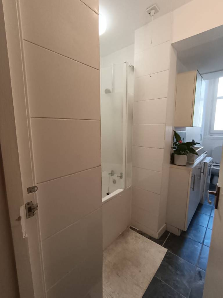 A slim white bathroom