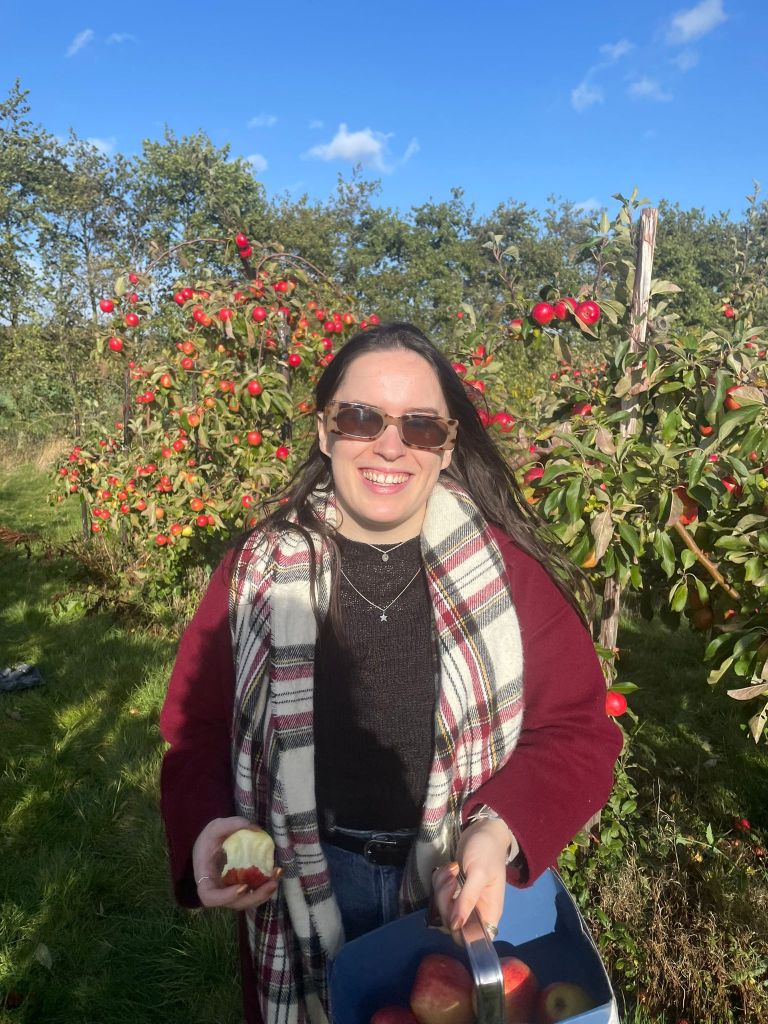 I smile holding my apples