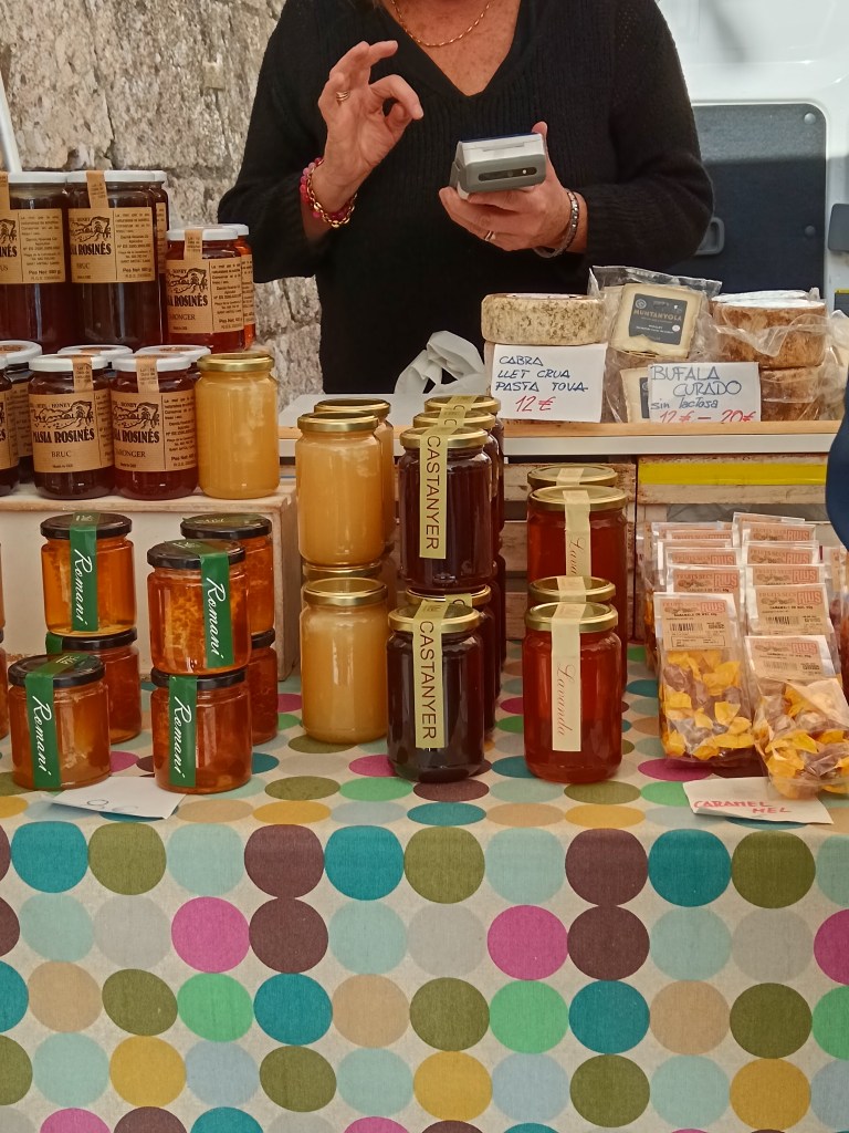 Jars of honey on a farmers market stall