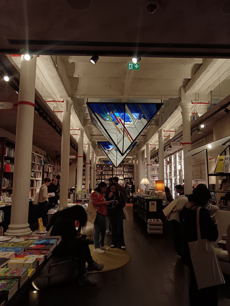 A gorgoeus bookshop with stain glass art