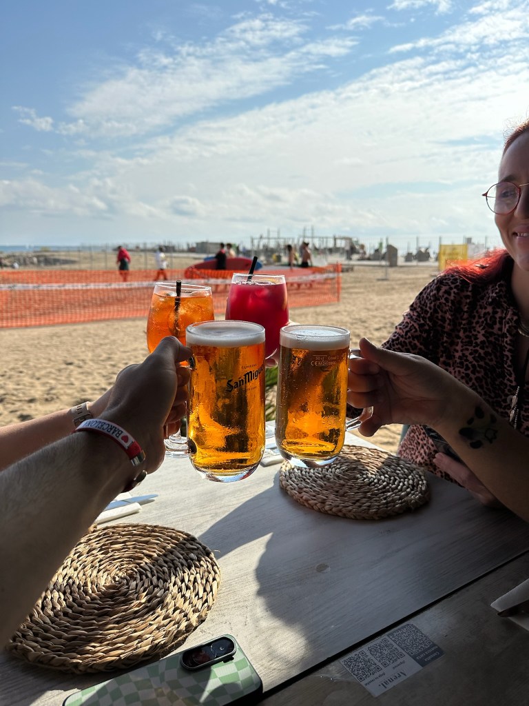 We cheers our drinks on the beach