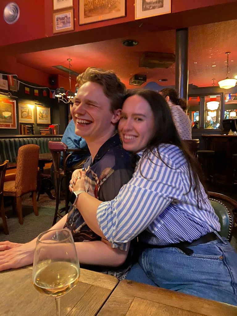 Jack and I cuddle and laugh in a pub
