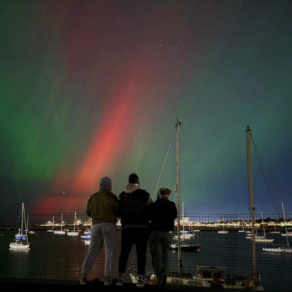 We look out at the northern lights over the harbour