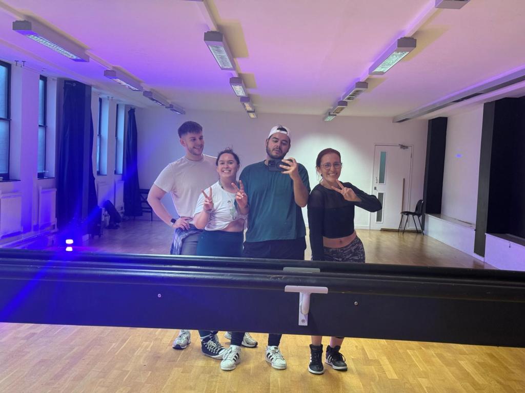 We pose for a mirror selfie in a dance studio