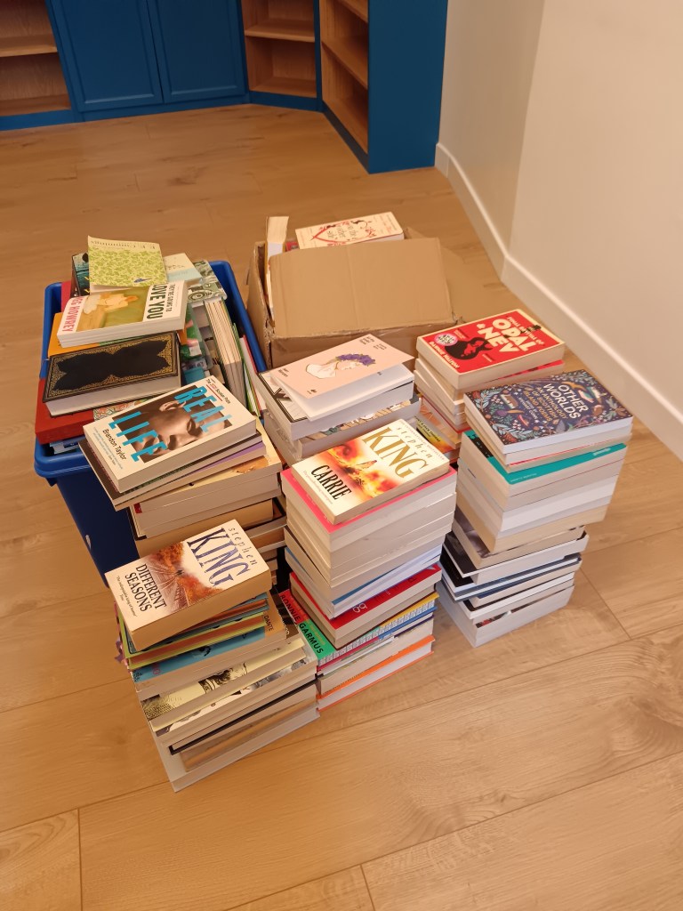 Stacks of my books waiting to be sorted