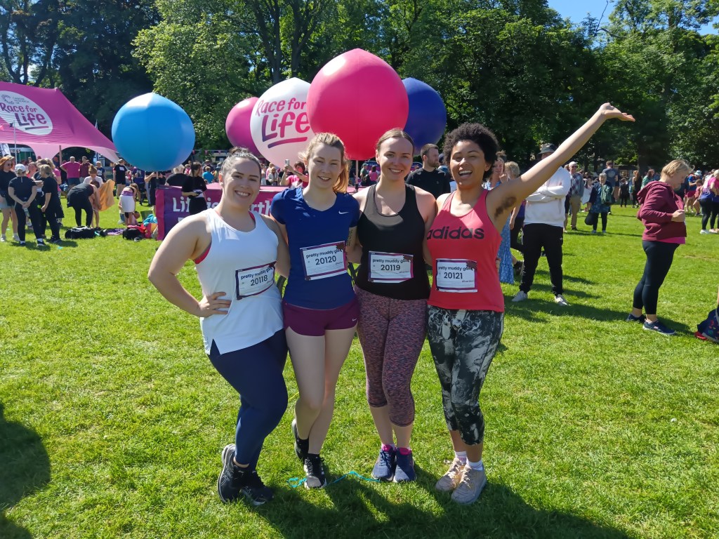 We smile ahead of our muddy race