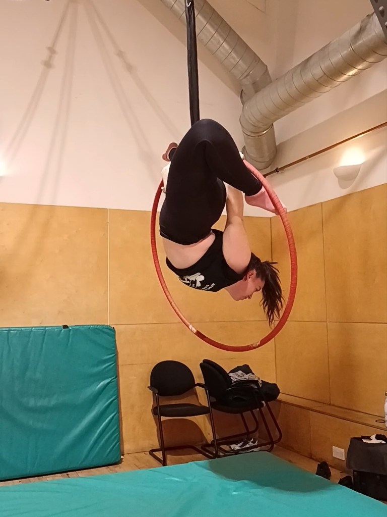 I hang upside in a hoop with one foot hooked
