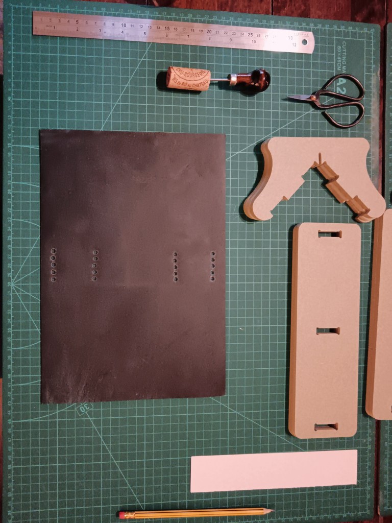 The leather cover and book binding tools