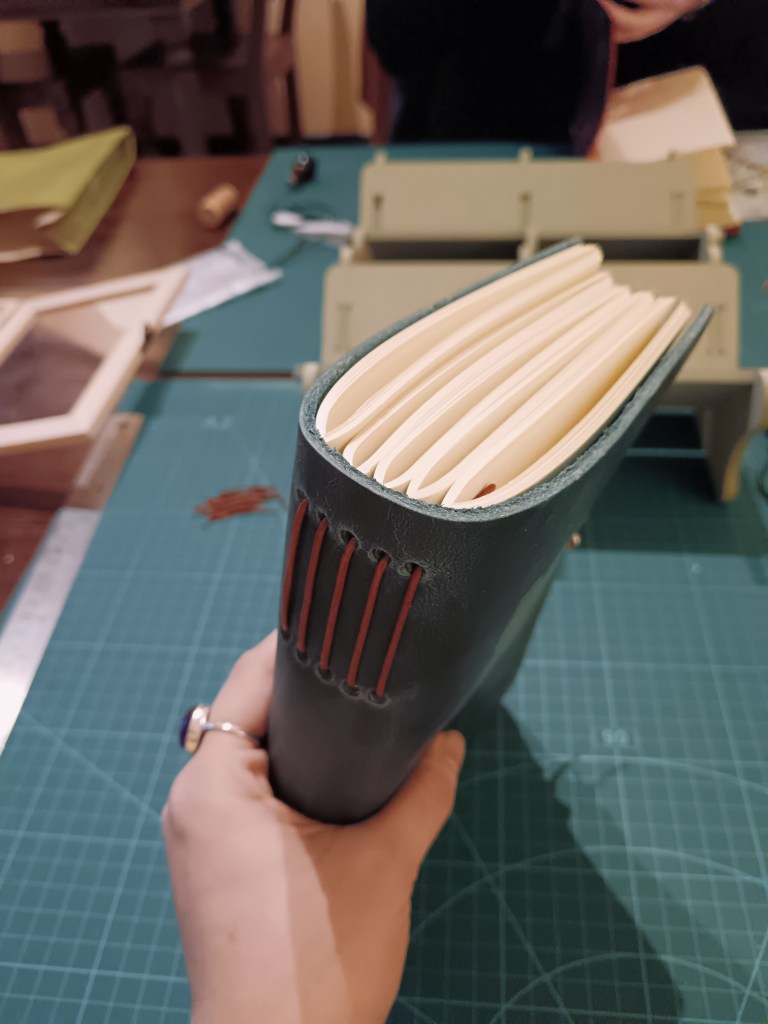 The spine of a notebook bound by me 