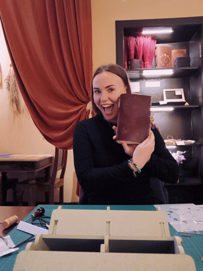 Helen smiles with the book she just made