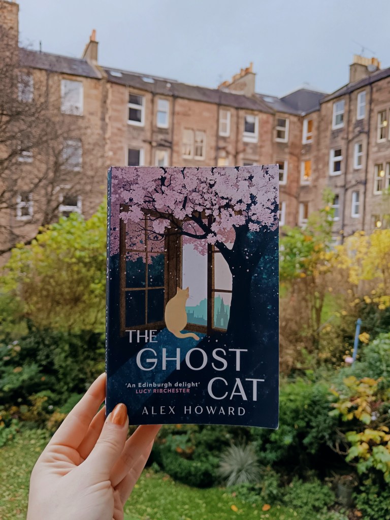 I hold up my pal's book The Ghost Cat