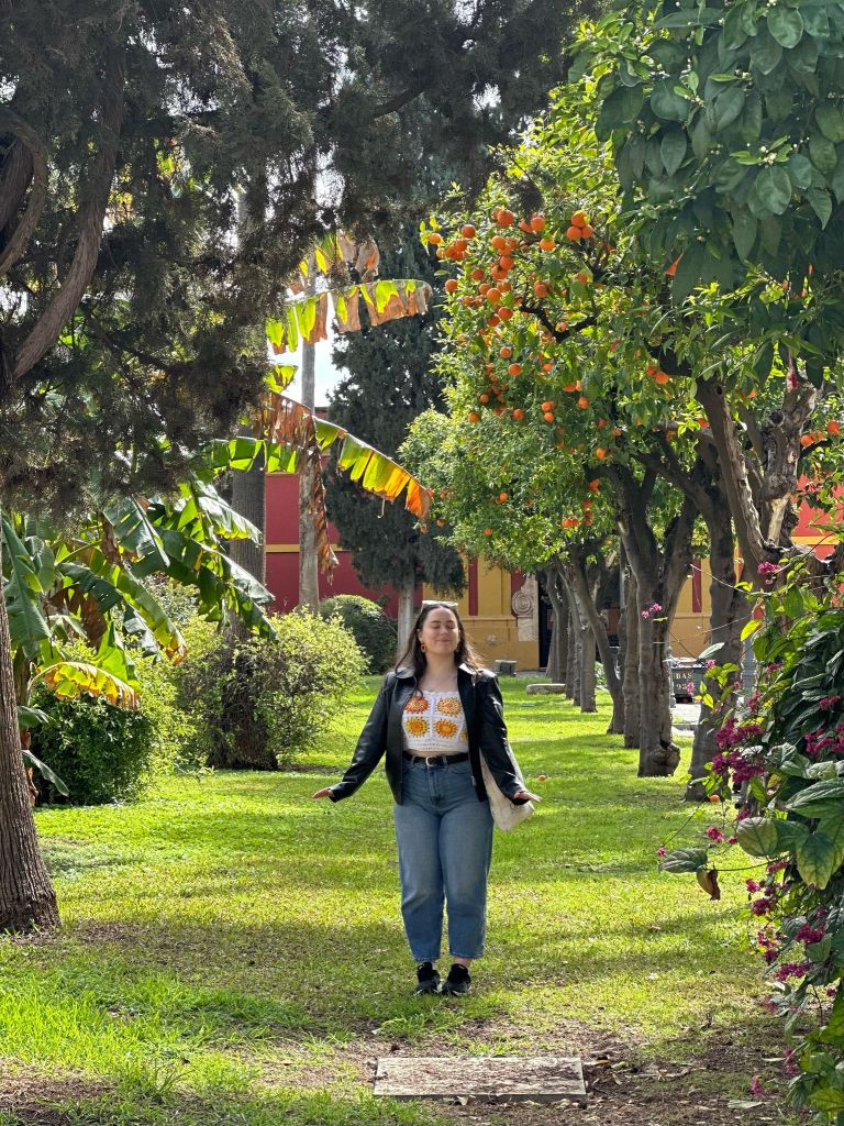 I look blissful beside orange trees
