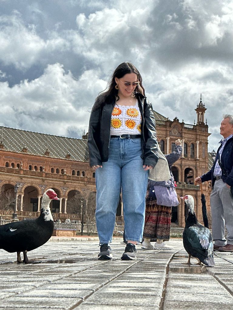 I look down at two ducks who stare up at me