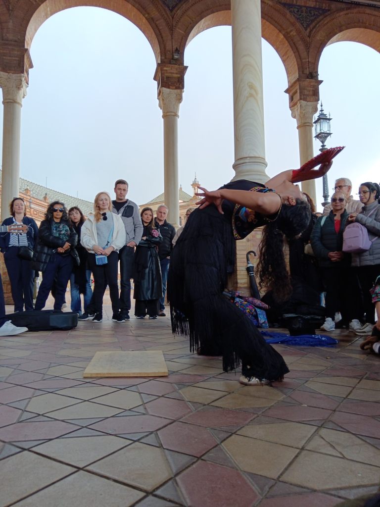 A flamenco dancer arches her back