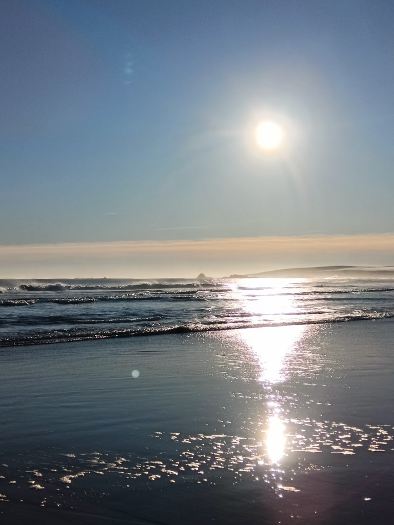 The sun glints on waves 