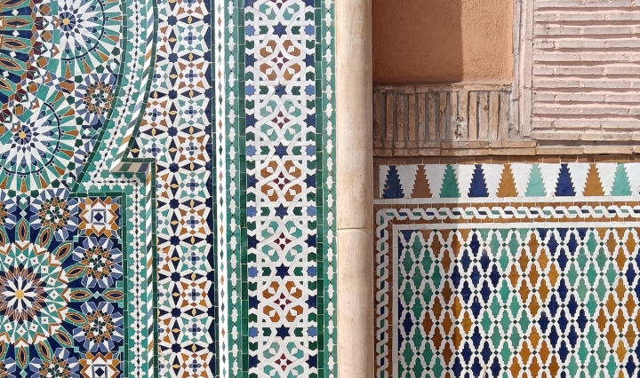 A wall with various colourful patterned tiles