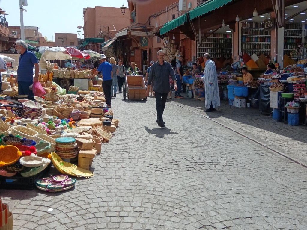 Stalls of spices and woven bags in the market