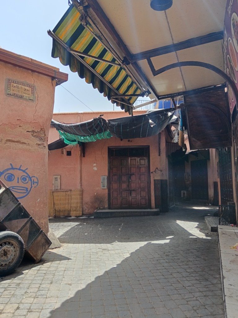 A quiet street corner covered by awnings