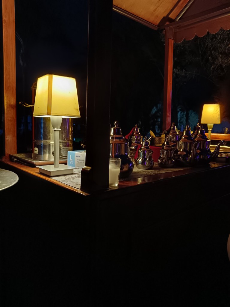 A cart lined with silver teapots