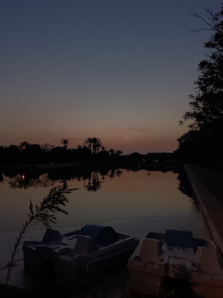 The sunset reflects on a pond