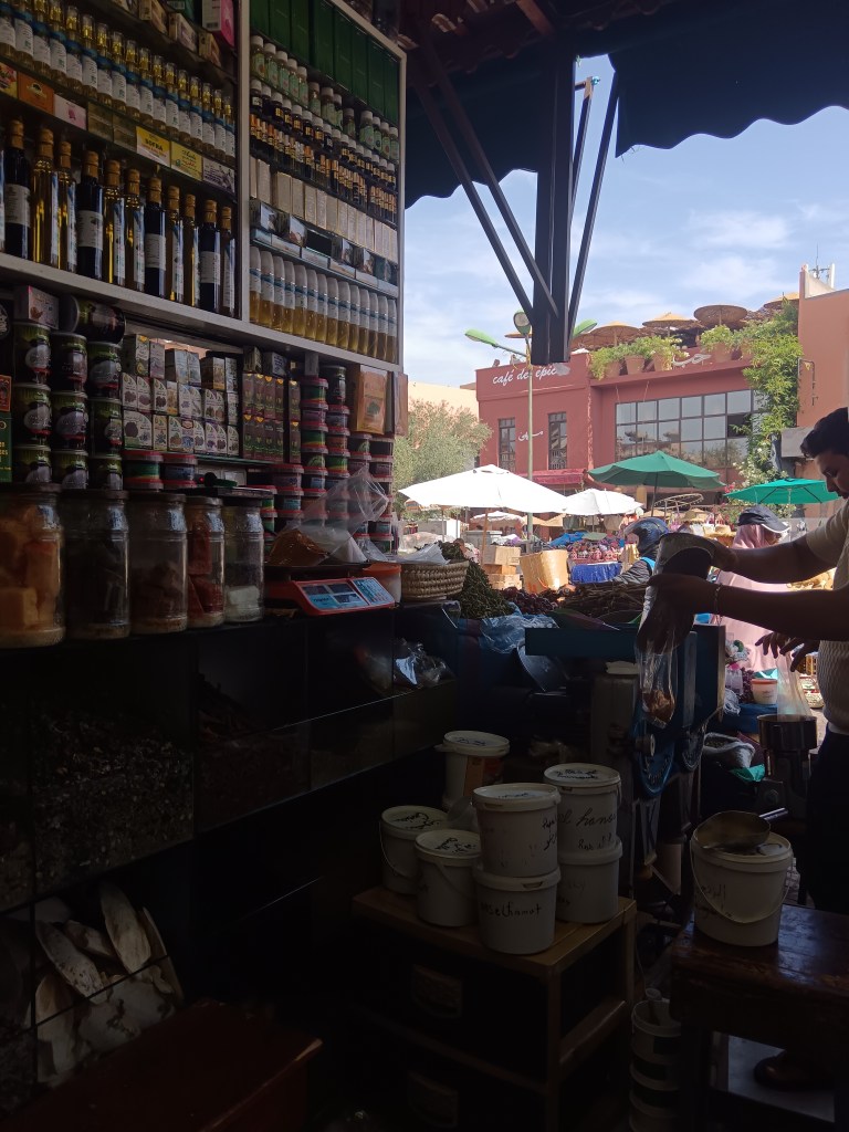 Jars of spices and other beauty products while our attendant grinds our spices