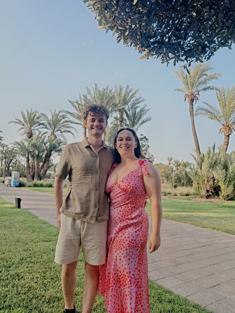 Kit and I smile together in our nice evening dress