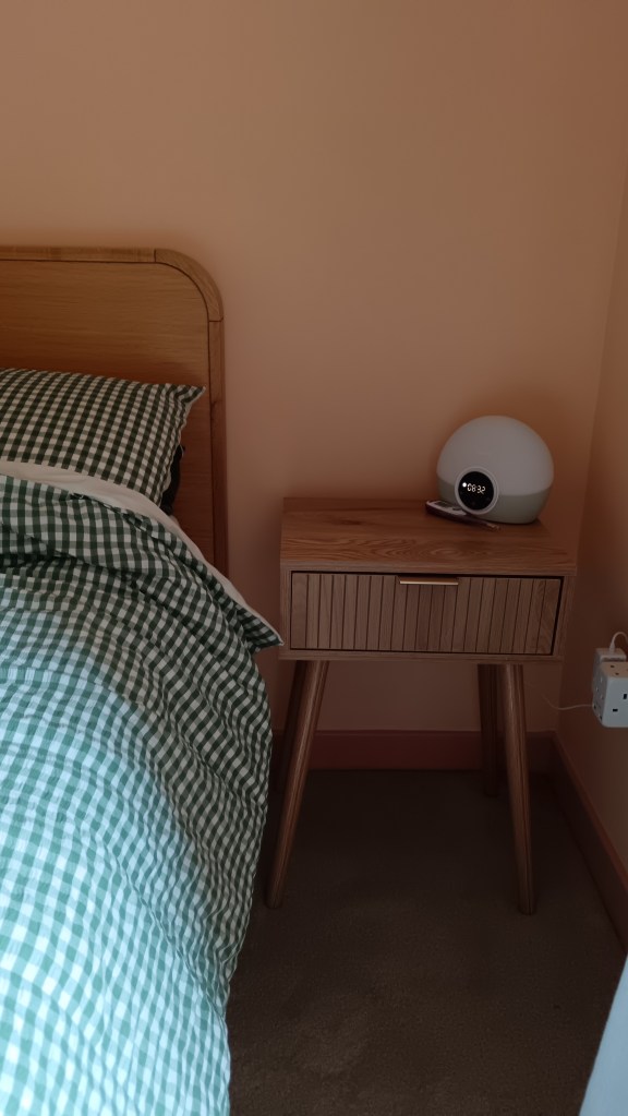 Close up shot of my Lumie lamp on my bedside table