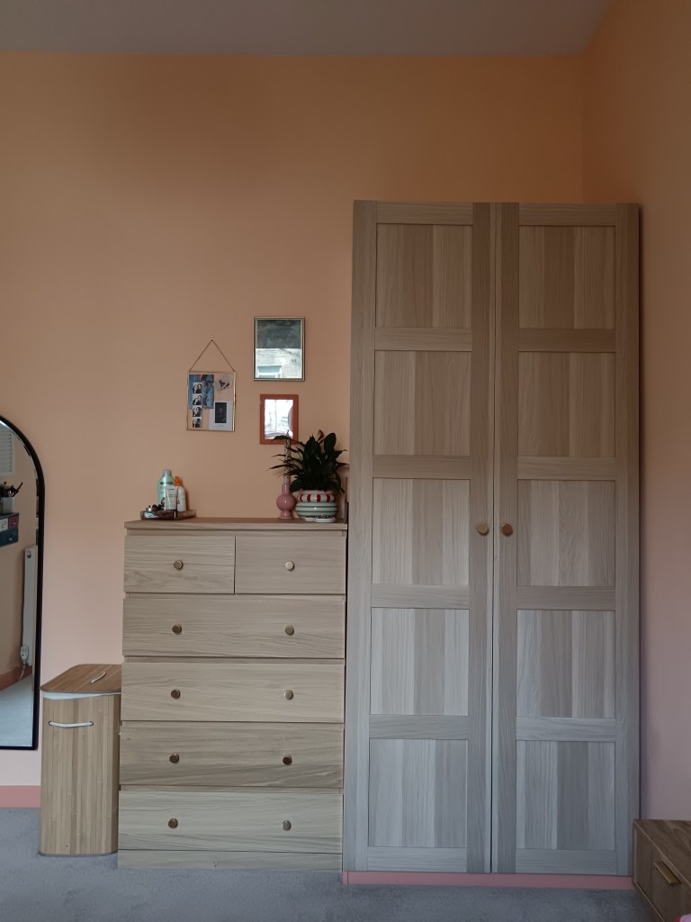 My IKEA drawers and wardrobe studded with round gold knobs