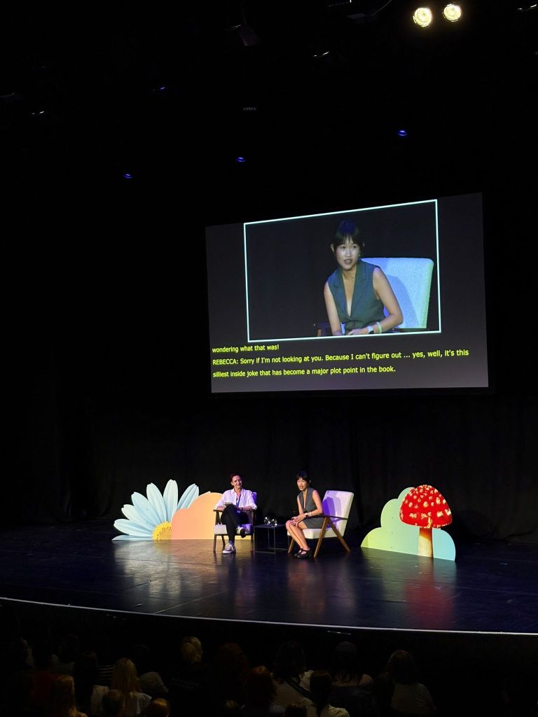 RF Kuang smiles as she is interviewed on stage