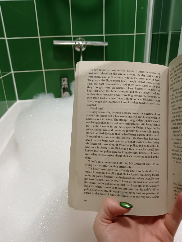 I hold a book open to read while in a bubble bath