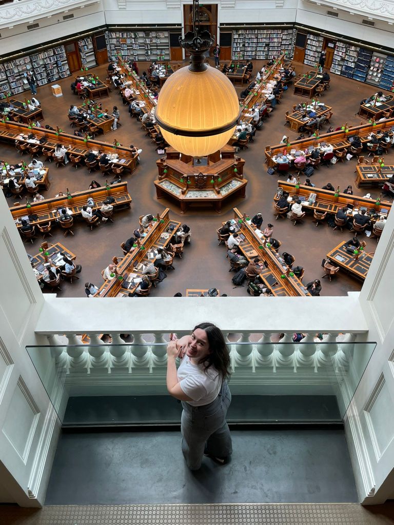 I look up smiling inside the gorgeous State Library