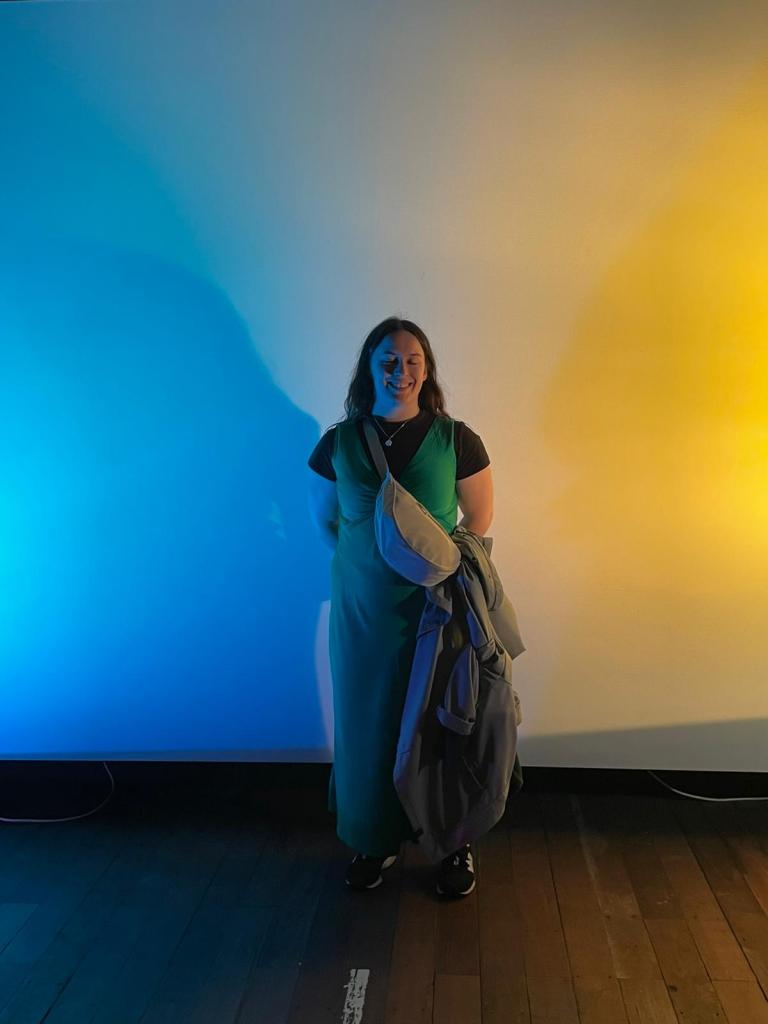 I smile illuminated by coloured lights