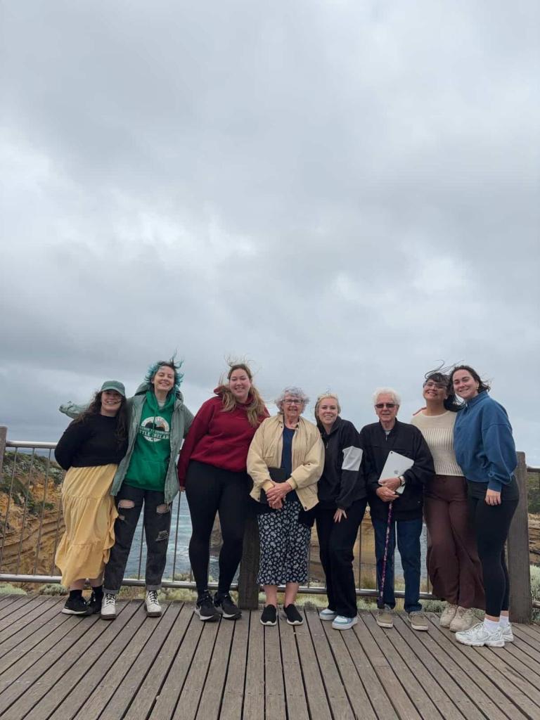 Our tour group stand together and smile