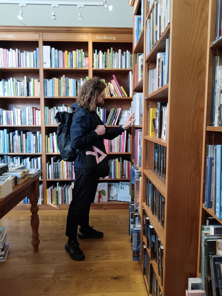 Kit browsing in a bookshop