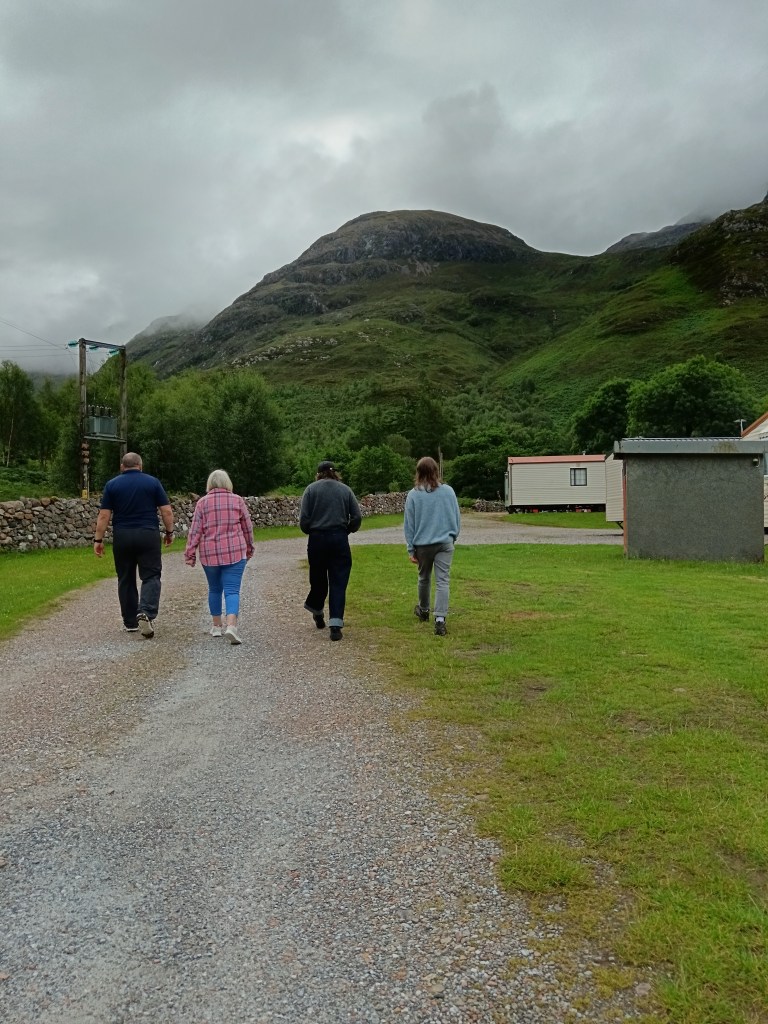 My family walk together in misty mountains