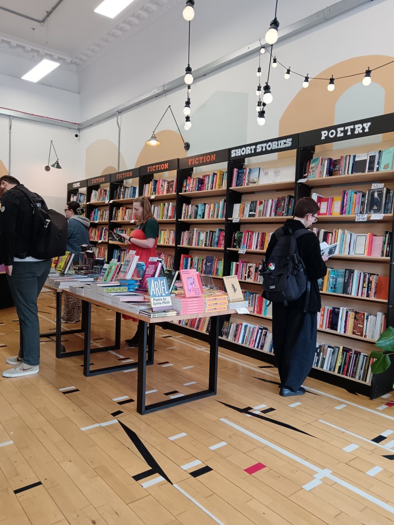 People browse in a pretty bookshop