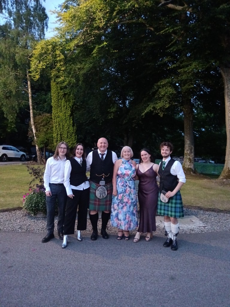 A family photo at a wedding