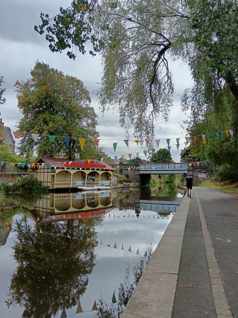 The boathouse reflects on the canal
