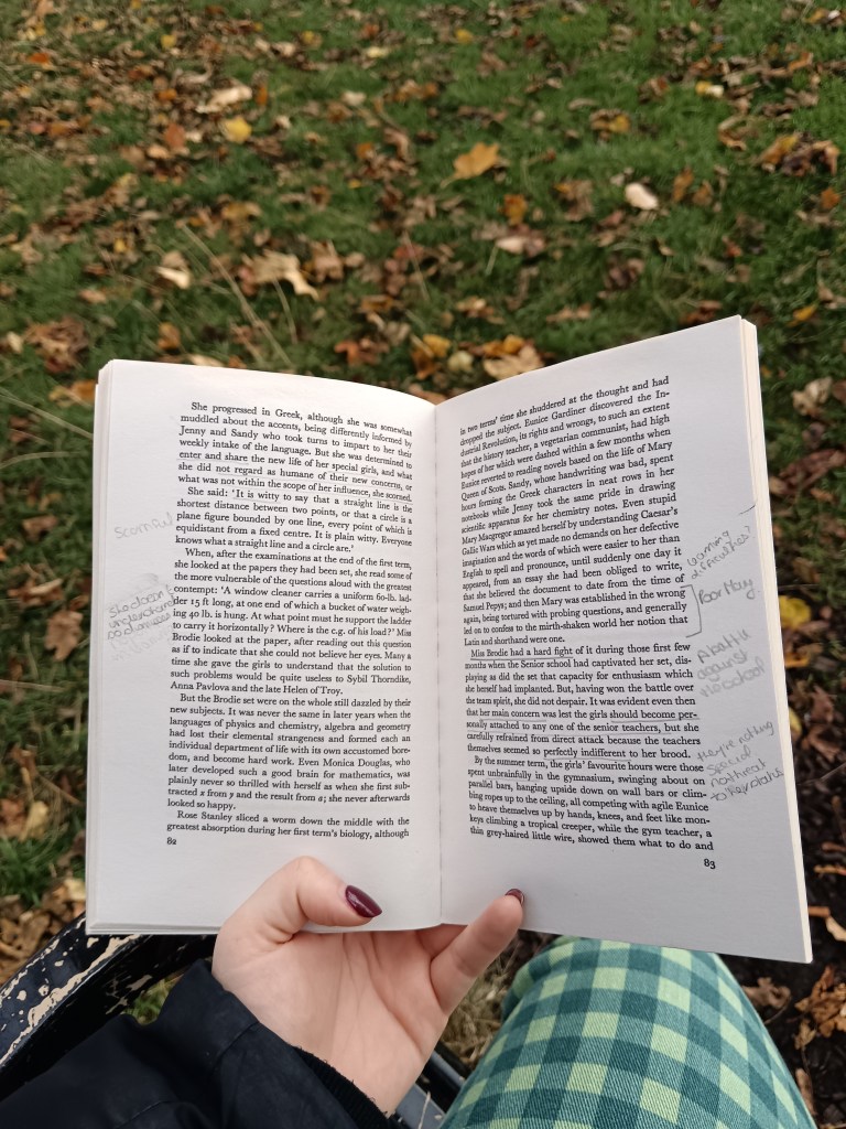 Holding an open book with annotations