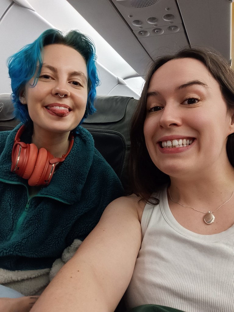 Ejay and I smile for a selfie on the plane