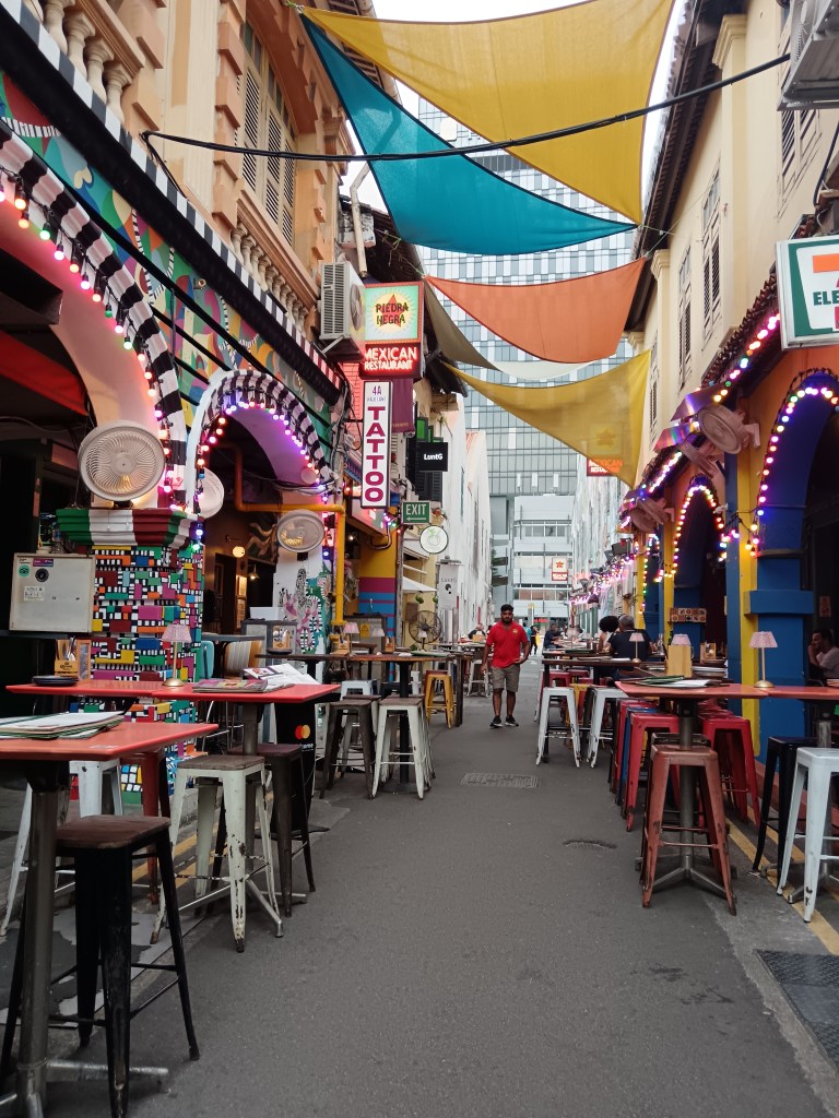 A colourful street lined with bars