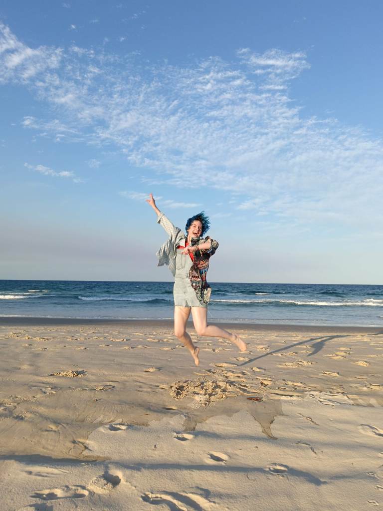 Ejay jumps for joy on the beach