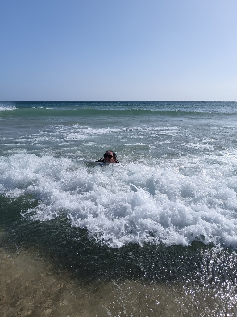 I smile in the waves