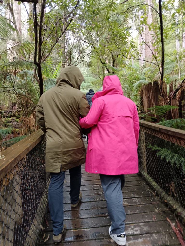 Stu and Georgia hold each other's arms and walk together