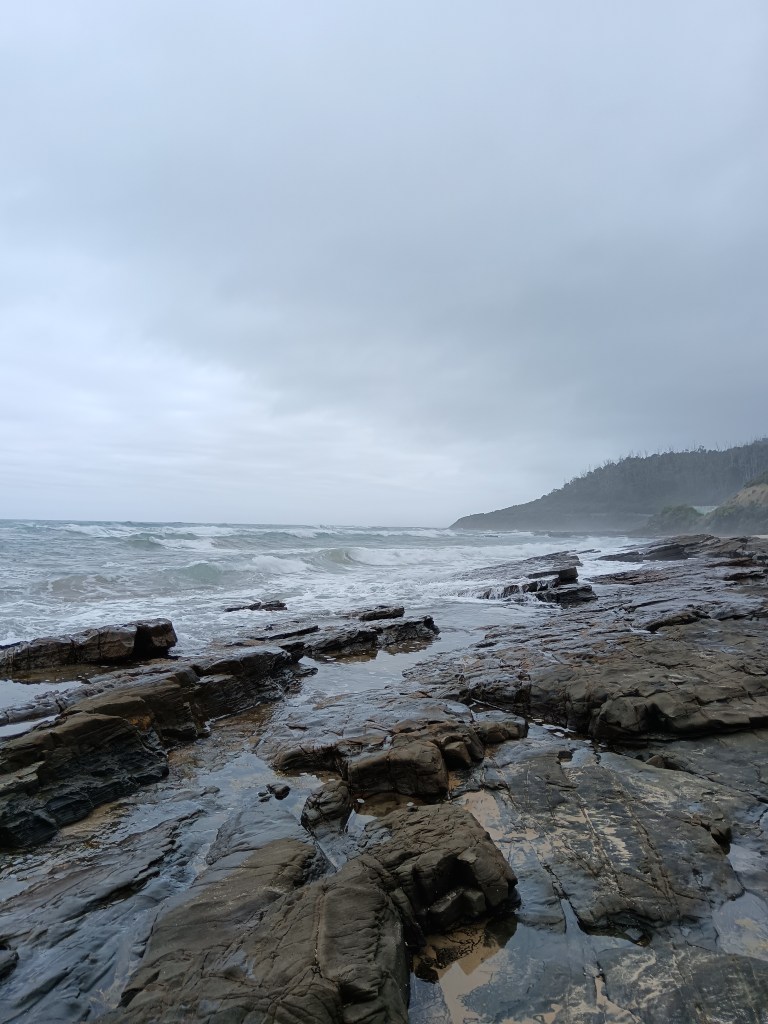 Dramatic waves come in over the rocks