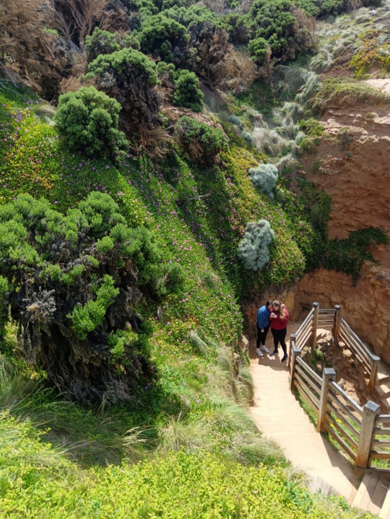 Karli and Teyja huddle togther in a cove
