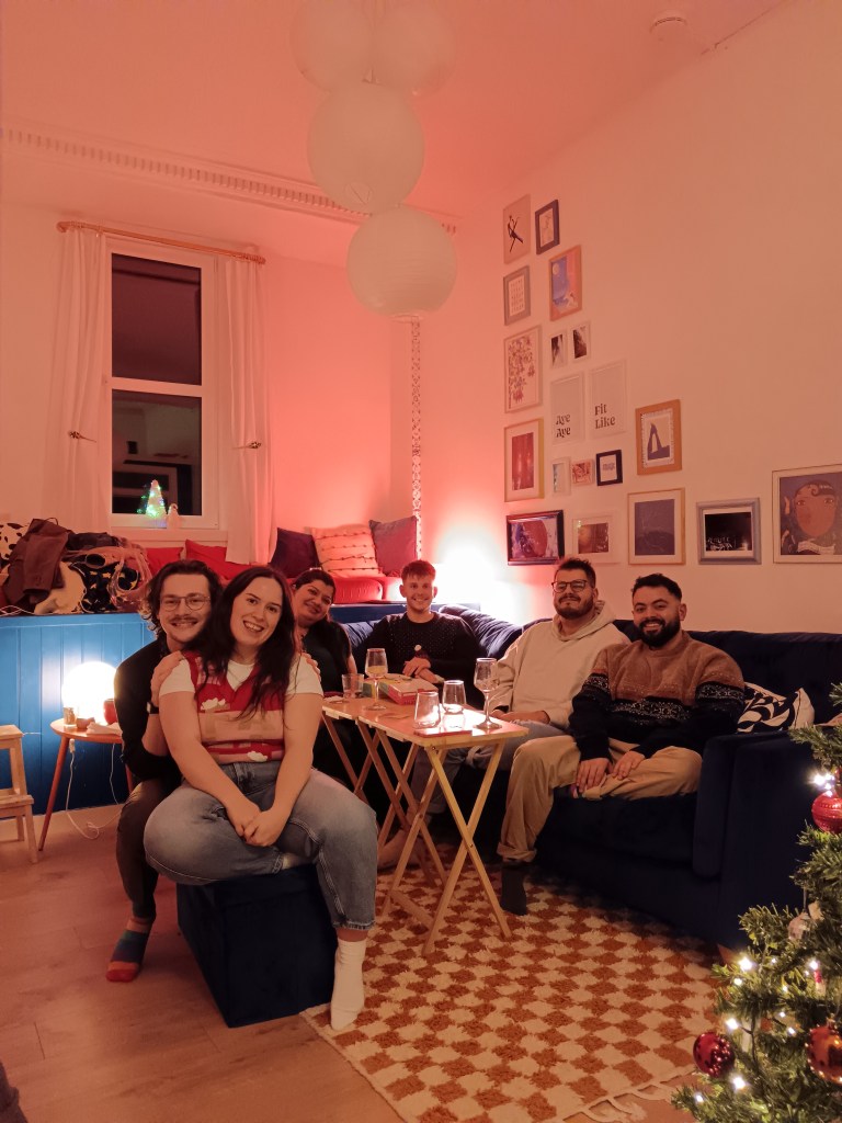 My friends snuggle round the dinner table in my flat
