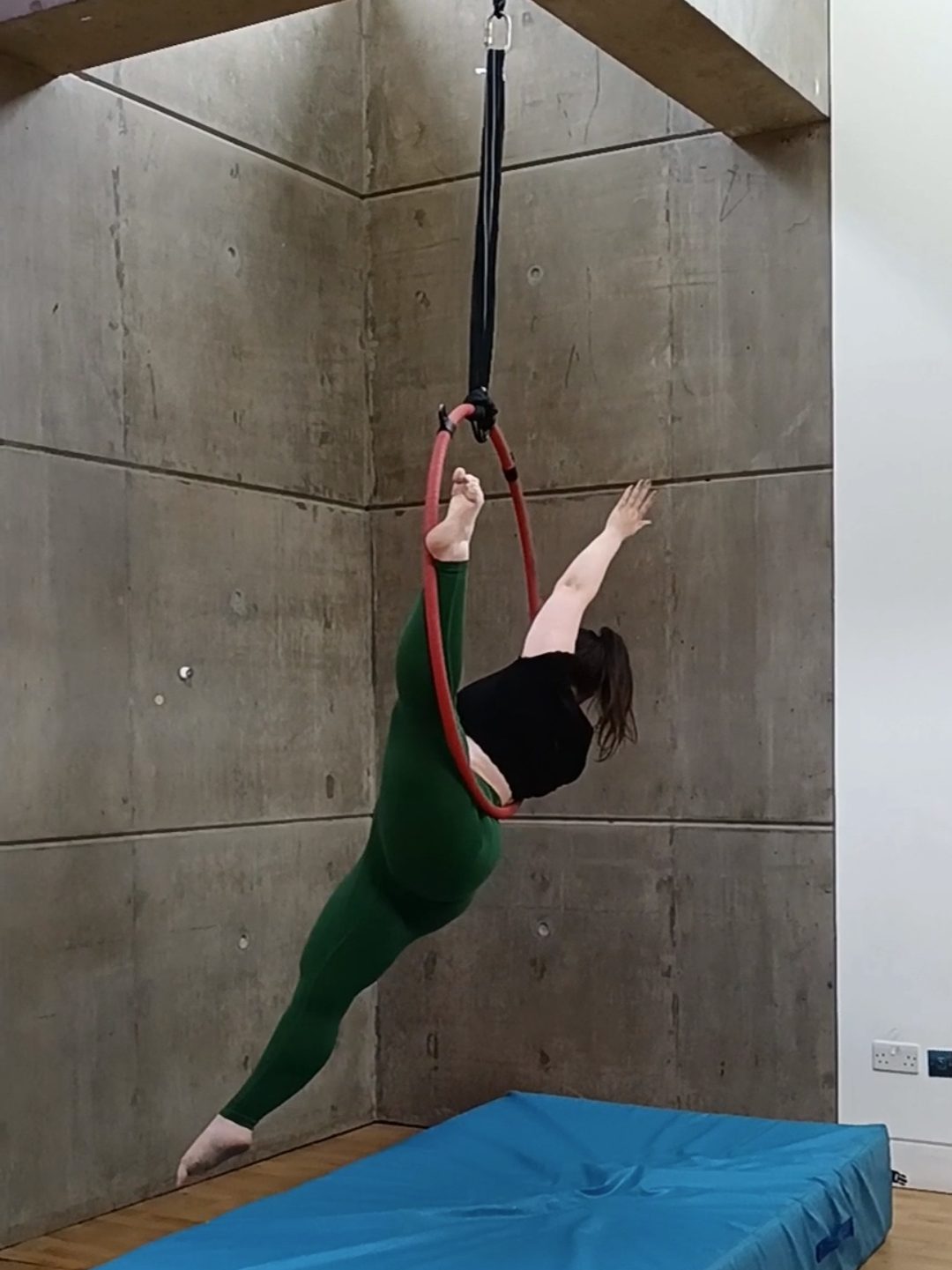On an aerial hoop I hold one leg up