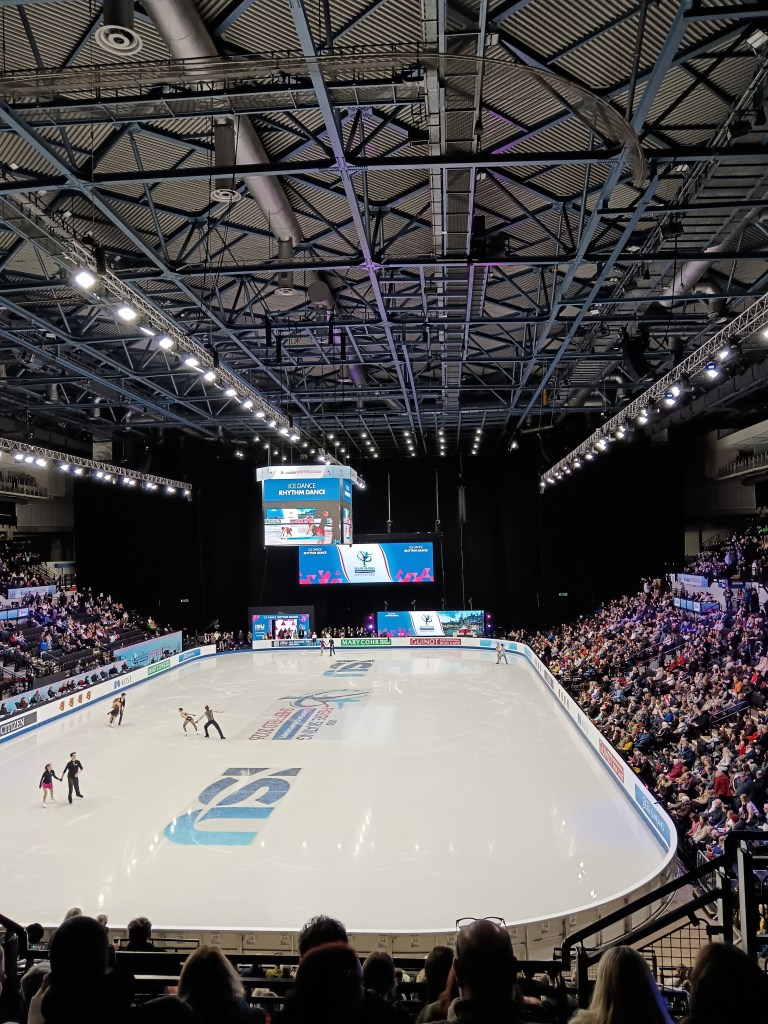Skaters warming up in the ice rink
